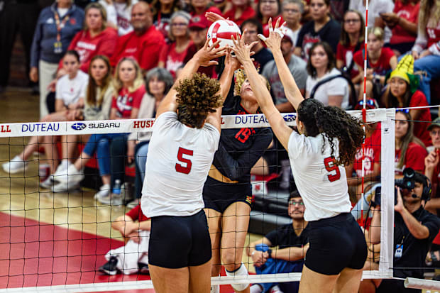 Rebekah Allick (5) and Virginia Adriano (9) go up for a block. 