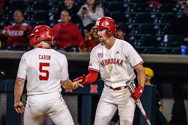 Josh Caron and Dylan Carey celebrate the Huskers taking the lead in the seventh inning. 