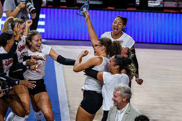 The Huskers celebrate Allick's MVP honors. 