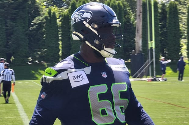 Seahawks guard McClendon Curtis looks on during a blocking drill at mandatory minicamp.