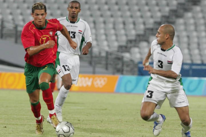 Portugal's Cristiano Ronaldo (L) tries t