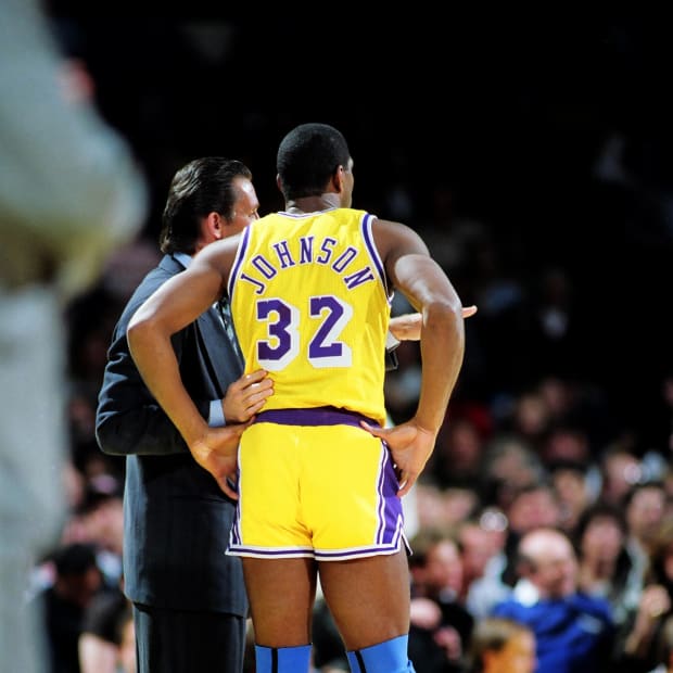 Unknown date 1984; Inglewood, CA; USA; FILE PHOTO; Los Angeles Lakers head coach Pat Riley talks with Magic Johnson (32) during a game at The Forum.  Mandatory Credit: Jayne Kamin-Oncea-USA TODAY Sports