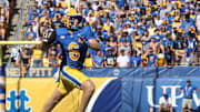 Oct 4, 2025; Pittsburgh, Pennsylvania, USA;  Pittsburgh Panthers quarterback Mason Heintschel (6) passes on the run against the Boston College Eagles during the second quarter at Acrisure Stadium. Mandatory Credit: Charles LeClaire-Imagn Images
