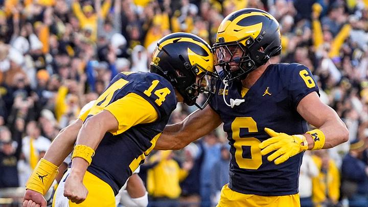 Michigan quarterback Tommy Carr (14), left, celebrates a first down against Penn State with wide receiver JJ Buchanan (6) during the second half at Michigan Stadium in Ann Arbor on Saturday, Oct. 17, 2026.