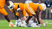 Tennessee defensive lineman Joshua Josephs (19) picks up a fumbled ball after Mississippi State quarterback Blake Shapen (2) is sacked by Tennessee defensive lineman Tyre West (42) during a college football game between Tennessee and Mississippi State at Davis Wade Stadium in Starkville, Miss., on Sept. 27, 2025.