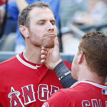 Angels left fielder Josh Hamilton (32) and right fielder Kole Calhoun (56) joke around before the game against the Texas Rangers at Globe Life Park in Arlington on July 10, 2014.