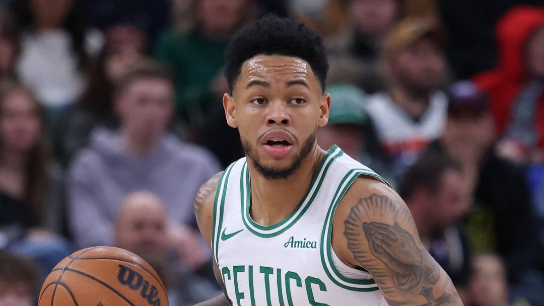 Dec 30, 2025; Salt Lake City, Utah, USA; Boston Celtics guard Anfernee Simons (4) brings the ball up the court against the Utah Jazz during the first half at Delta Center. Mandatory Credit: Rob Gray-Imagn Images