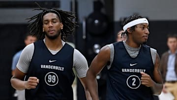 Vanderbilt forward Devin McGlockton (99) and guard M.J. Collins Jr. (2) warm up during an NCAA college basketball practice Tuesday, October 8, 2024, in Nashville, Tenn.