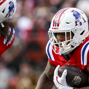 New England Patriots running back Treveyon Henderson runs the ball during the third quarter at Gillette Stadium.