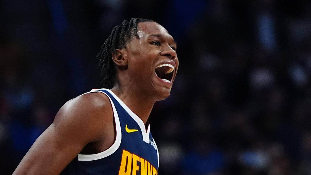 Nov 6, 2024; Denver, Colorado, USA; Denver Nuggets forward Peyton Watson (8) reacts in the fourth quarter against the Oklahoma City Thunder at Ball Arena. Mandatory Credit: Ron Chenoy-Imagn Images