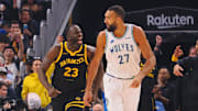 Nov 12, 2023; San Francisco, California, USA; Golden State Warriors forward Draymond Green (23) celebrates behind Minnesota Timberwolves center Rudy Gobert (27) after scoring a three point basket during the first quarter at Chase Center.