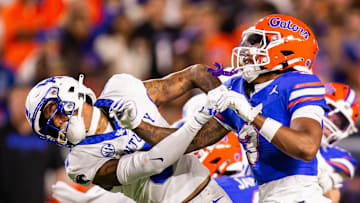 Kentucky Wildcats wide receiver Dane Key (6) and Florida Gators defensive back Jason Marshall Jr. (3) go at it during a play during the first half at Ben Hill Griffin Stadium in Gainesville, FL on Saturday, October 19, 2024 against the Kentucky Wildcats. [Doug Engle/Gainesville Sun]