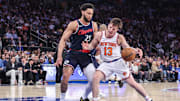 Mar 26, 2025; New York, New York, USA;  New York Knicks guard Tyler Kolek (13) looks to drive past LA Clippers guard Ben Simmons (25) in the third quarter at Madison Square Garden. Mandatory Credit: Wendell Cruz-Imagn Images