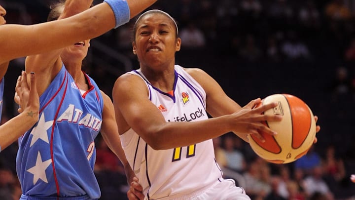 May 28, 2010; Phoenix, AZ, USA; Phoenix Mercury guard Ketia Swanier (11) puts up a shot against Atlanta Dream Kelly Miller during the first half at US Airways Center.  Mandatory Credit: Jennifer Stewart-Imagn Images