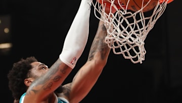 Mar 12, 2025; Atlanta, Georgia, USA; Charlotte Hornets forward Miles Bridges (0) dunks against the Atlanta Hawks during the second half at State Farm Arena. Mandatory Credit: Mady Mertens-Imagn Images