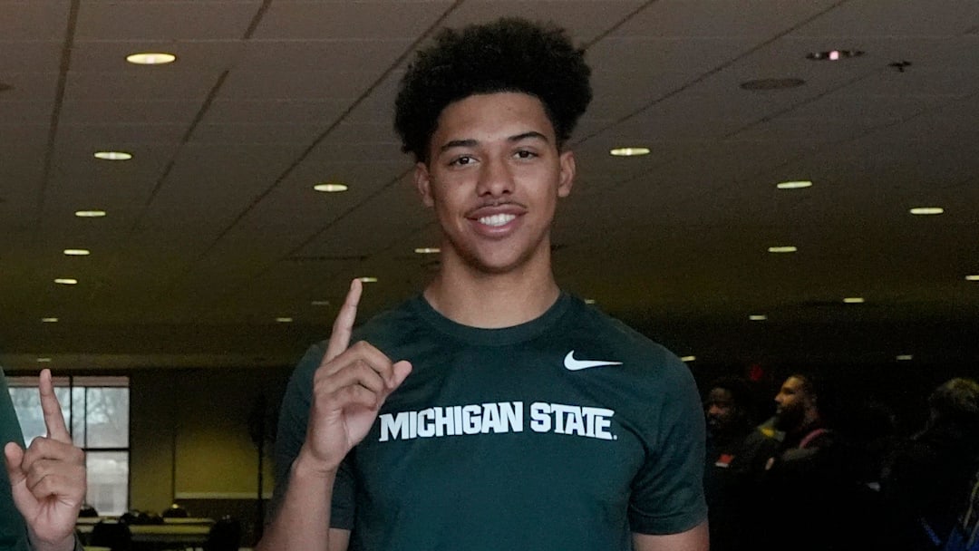 From left, Charles White and Jayden Savoury show off their pride after signing to play football with Michigan State University at Orchard Lake St. Mary’s Preparatory in Orchard Lake on Wednesday, Dec. 4, 2024.