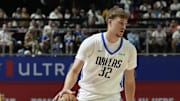 Jul 10, 2025; Las Vegas, NV, USA; Dallas Mavericks forward Cooper Flagg (32) dribbles against Los Angeles Lakers guard Bronny James (9) in the first quarter of their game at Thomas & Mack Center. Mandatory Credit: Candice Ward-Imagn Images