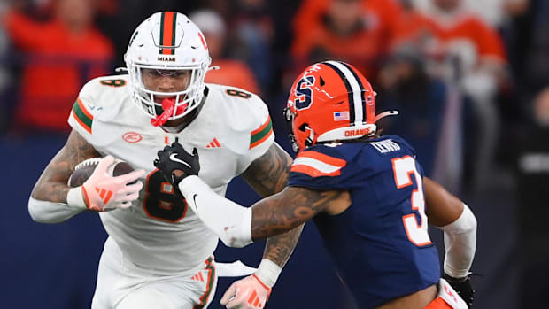 Miami Hurricanes tight end Elijah Arroyo (8) runs with the ball after a catch