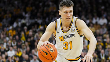 Feb 8, 2025; Columbia, Missouri, USA; Missouri Tigers guard Caleb Grill (31) drives during the first half against the Texas A&M Aggies at Mizzou Arena. Mandatory Credit: Jay Biggerstaff-Imagn Images