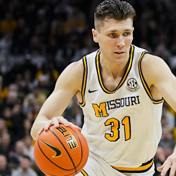 Feb 8, 2025; Columbia, Missouri, USA; Missouri Tigers guard Caleb Grill (31) drives during the first half against the Texas A&M Aggies at Mizzou Arena. Mandatory Credit: Jay Biggerstaff-Imagn Images