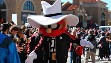 Nov 9, 2024; Lubbock, Texas, USA; The Texas Tech Red Raiders mascot greets fans before the the game between the Texas Tech Red Raiders and the Colorado Buffalos at Jones AT&T Stadium and Cody Campbell Field. Mandatory Credit: Michael C. Johnson-Imagn Images