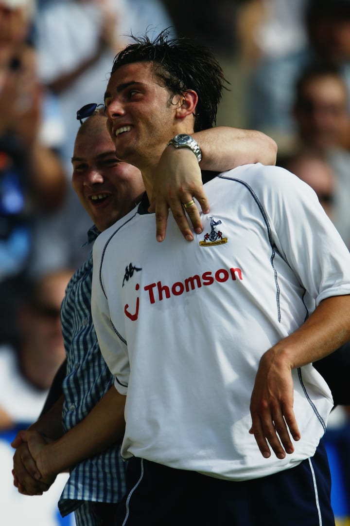 Helder Postiga of Tottenham Hotspur celebrates his goal with a fan