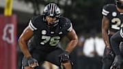 Mississippi State Bulldogs offensive lineman Albert Reese IV (76) and offensive lineman Zack Owens (52) wait for the snap during the second quarter against the Arizona State Sun Devils at Davis Wade Stadium at Scott Field.