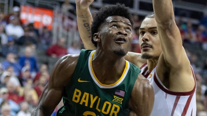 Mar 15, 2024; Kansas City, MO, USA; Baylor Bears center Yves Missi (21) drives to the basket during the second half at T-Mobile Center. Mandatory Credit: William Purnell-USA TODAY Sports