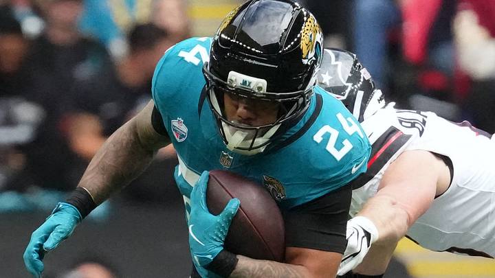 Oct 18, 2026; London, ENG;  Jacksonville Jaguars running back Chris Rodriguez Jr. (24) carries the ball against Houston Texans safety Reed Blankenship (6) during the first half at Wembley Stadium.  