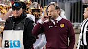 Nov 18, 2023; Columbus, Ohio, USA; Minnesota Golden Gophers head coach P. J. Fleck talks in his headset during the NCAA football game against the Ohio State Buckeyes at Ohio Stadium.