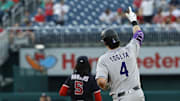 Jun 17, 2025; Washington, District of Columbia, USA; Colorado Rockies first baseman Michael Toglia (4) gestures to his bullpen while rounding the bases after hitting a two run home run against the Washington Nationals during the fourth inning at Nationals Park. 