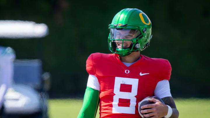 Oregon quarterback Dillon Gabriel walks the field during practice with the Ducks Tuesday, Aug. 13, 2024 at the Hatfield-Dowlin Complex in Eugene, Ore.