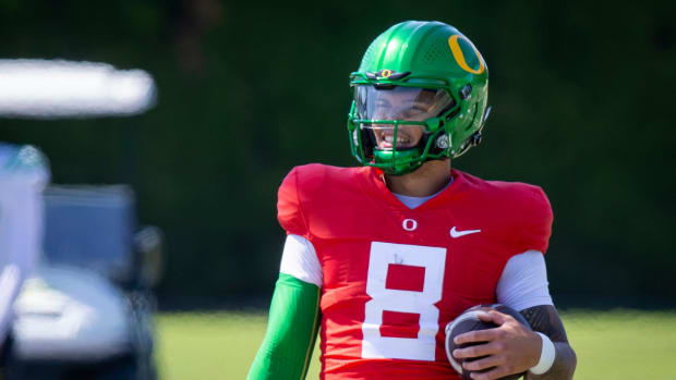 Oregon quarterback Dillon Gabriel walks the field during practice with the Ducks 