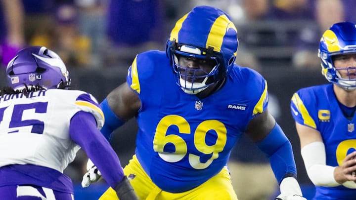 Jan 13, 2025; Glendale, AZ, USA; Los Angeles Rams guard Kevin Dotson (69) wears a guardian cap on his helmet against the Minnesota Vikings during an NFC wild card game at State Farm Stadium. Mandatory Credit: Mark J. Rebilas-Imagn Images Jan 13, 2025; Glendale, AZ, USA; Los Angeles Rams guard Kevin Dotson (69) wears a guardian cap on his helmet against the Minnesota Vikings during an NFC wild card game at State Farm Stadium. Mandatory Credit: Mark J. Rebilas-Imagn Images