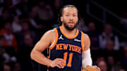 Feb 26, 2025; New York, New York, USA; New York Knicks guard Jalen Brunson (11) brings the ball up court against the Philadelphia 76ers during the first quarter at Madison Square Garden.