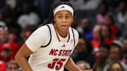 Nov 9, 2025; Charlotte, North Carolina, USA; NC State Wolfpack guard Zoe Brooks (35) dribbles the ball against the Southern California Trojans during the second quarter of the Ally Tipoff game at Spectrum Center. Mandatory Credit: Cory Knowlton-Imagn Images