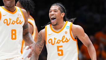 Tennessee guards Zakai Zeigler (5) and Darlinstone Dubar (8) smiling in celebration after Zeiglier sinks a 3-point shot during the Sweet 16 game against Kentucky in the NCAA college basketball tournament on Friday, March 28, 2025, in Indianapolis, IN.