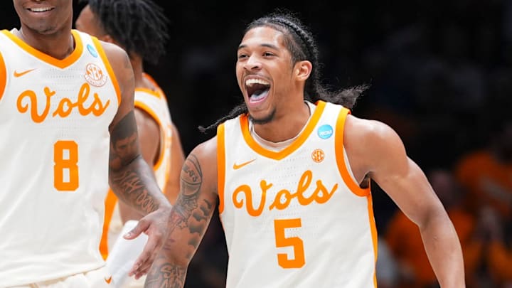 Tennessee guards Zakai Zeigler (5) and Darlinstone Dubar (8) smiling in celebration after Zeiglier sinks a 3-point shot during the Sweet 16 game against Kentucky in the NCAA college basketball tournament on Friday, March 28, 2025, in Indianapolis, IN.