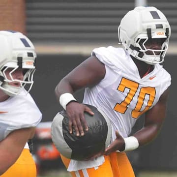 Tennessee offensive lineman David Sanders Jr. (70) and Tennessee offensive lineman Jesse Perry (72) during Tennessee football preseason practice, in Knoxville, Tennessee, July 31, 2025.