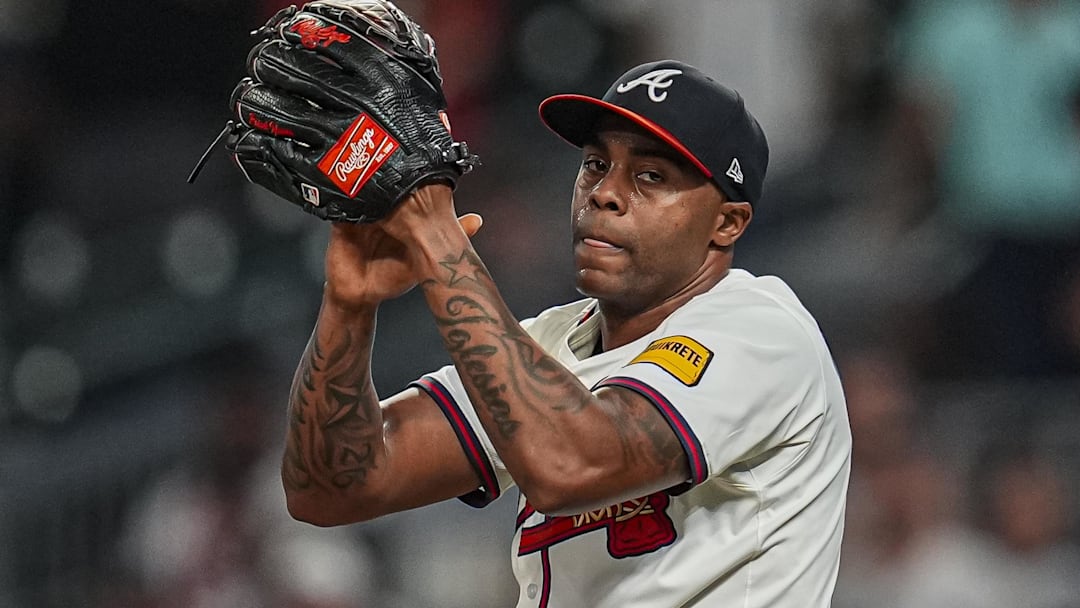 Sep 23, 2025; Cumberland, Georgia, USA; Atlanta Braves relief pitcher Raisel Iglesias (26)  reacts after the Braves defeated the Washington Nationals at Truist Park.