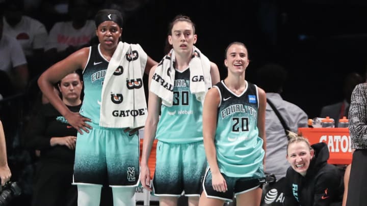 Aug 6, 2023; Brooklyn, New York, USA; New York Liberty forwards Jonquel Jones (35) and Breanna Stewart (30) and guard Sabrina Ionescu (20) watch the game from the bench in the fourth quarter against the Las Vegas Aces at Barclays Center. Mandatory Credit: Wendell Cruz-USA TODAY Sports