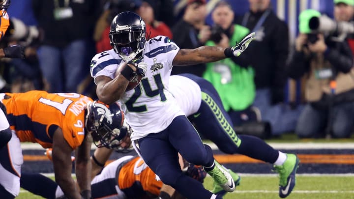 Feb 2, 2014; East Rutherford, NJ, USA; Seattle Seahawks running back Marshawn Lynch (24) runs in the third quarter against the Denver Broncos in Super Bowl XLVIII at MetLife Stadium.  Mandatory Credit: Joe Camporeale-USA TODAY Sports