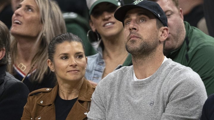 Danica Patrick and Aaron Rodgers look on during the fourth quarter in game two of the first round of the 2019 NBA Playoffs between the Detroit Pistons and Milwaukee Bucks at Fiserv Forum. 