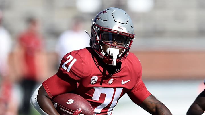 Aug 31, 2024; Pullman, Washington, USA; Washington State Cougars running back Wayshawn Parker (21) carries the ball against the Portland State Vikings in the second half at Gesa Field at Martin Stadium. Mandatory Credit: James Snook-USA TODAY Sports