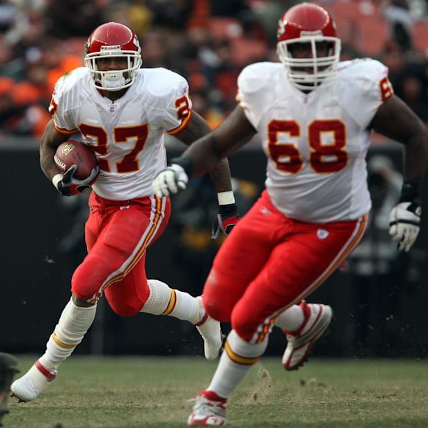 Will Shields leads the way for Kansas City Chiefs running back  Larry Johnson in 2006.