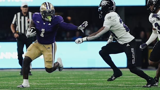 Jonah Coleman stiff-armed more than one Weber State defender in the opener.