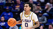 Feb 22, 2025; Baton Rouge, Louisiana, USA;  LSU Tigers guard Vyctorius Miller (0) brings the ball up court against the Florida Gators during the first half at Pete Maravich Assembly Center. Mandatory Credit: Stephen Lew-Imagn Images