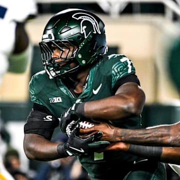 Michigan State's Brandon Tullis runs the ball against Michigan during the third quarter on Saturday, Oct. 25, 2025, at Spartan Stadium in East Lansing.