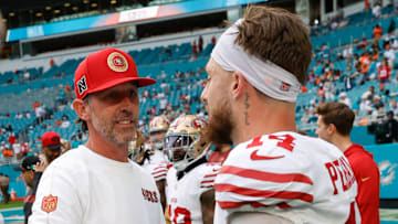 San Francisco 49ers head coach Kyle Shanahan (L) and wide receiver Ricky Pearsall (R)