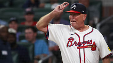 Atlanta Braves manager Brian Snitker (43) reacts to umpire Brian Walsh (120) after being ejected from a game against the Milwaukee Brewers in the fifth inning at Truist Park.